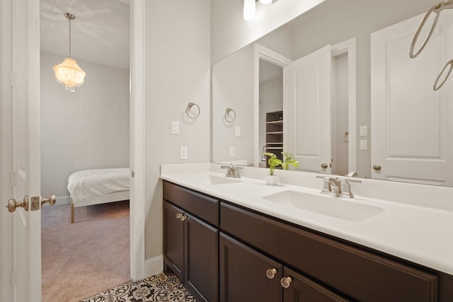 6919 Shoreline View Dr, Katy, TX 77493 - ensuite bathroom with double vanity and baseboards