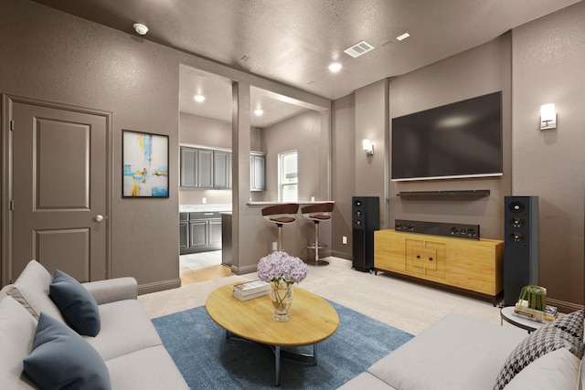 6919 Shoreline View Dr, Katy, TX 77493 - living area featuring light colored carpet, a textured wall, and a textured ceiling