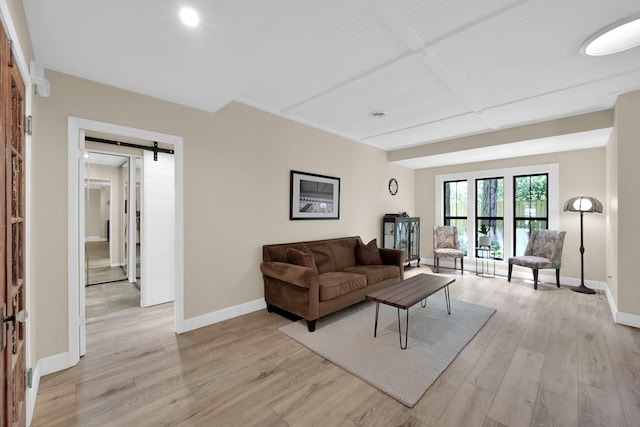 58 Sandpebble Dr, Spring, TX 77381 - living area with light wood-style flooring, a barn door, and recessed lighting
