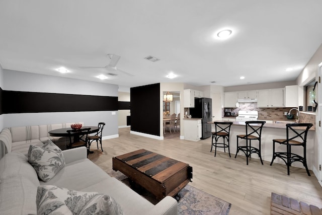 58 Sandpebble Dr, Spring, TX 77381 - living area with light wood-style flooring, recessed lighting, and ceiling fan