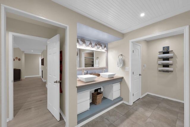 58 Sandpebble Dr, Spring, TX 77381 - bathroom featuring double vanity and baseboards