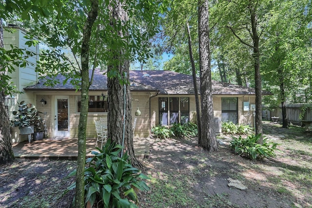 58 Sandpebble Dr, Spring, TX 77381 - single story home with a deck, brick siding, and roof with shingles