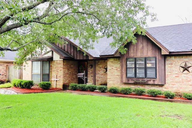 1108 Easy St, Rosenberg, TX 77471 - view of front of house with brick siding, a front yard, and roof with shingles