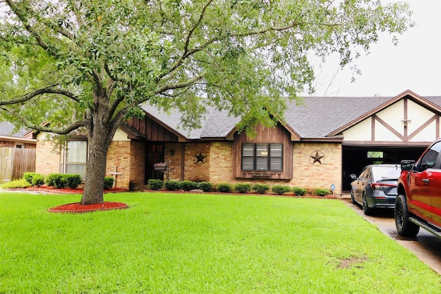 1108 Easy St, Rosenberg, TX 77471 - tudor-style house with brick siding, a shingled roof, a front yard, and an attached garage