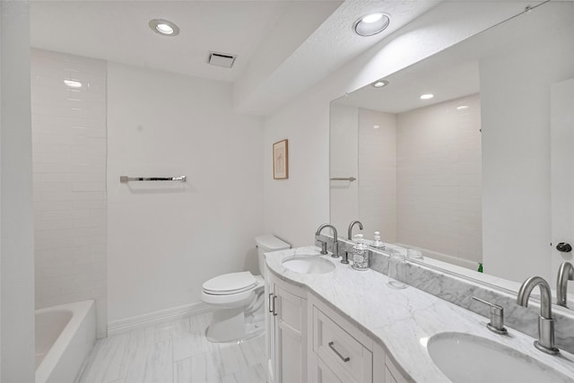 8033 Oakwood Forest Dr, Houston, TX 77040 - full bath featuring double vanity, recessed lighting, and marble look tiles