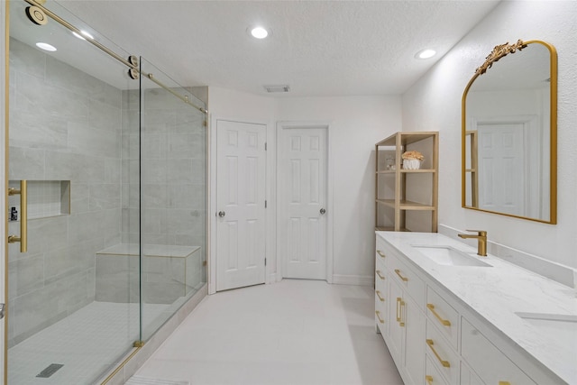 8033 Oakwood Forest Dr, Houston, TX 77040 - full bath featuring recessed lighting, a stall shower, double vanity, and a textured ceiling