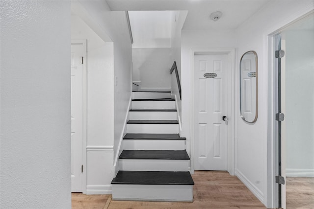 8033 Oakwood Forest Dr, Houston, TX 77040 - staircase with wood finished floors