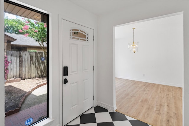 8033 Oakwood Forest Dr, Houston, TX 77040 - entryway with tile patterned floors and a chandelier