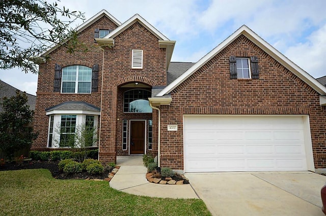 4202 Misty Waters Ln, Katy, TX 77494 - view of front facade featuring brick siding, driveway, and an attached garage