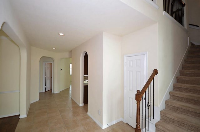 4202 Misty Waters Ln, Katy, TX 77494 - hall with arched walkways, recessed lighting, stairs, and light tile patterned floors