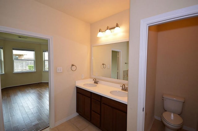 4202 Misty Waters Ln, Katy, TX 77494 - bathroom featuring double vanity and wood finished floors