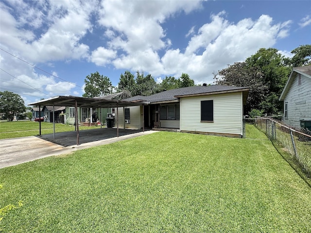 2066 Earl St, Beaumont, TX 77703 - rear view of house featuring a carport and driveway