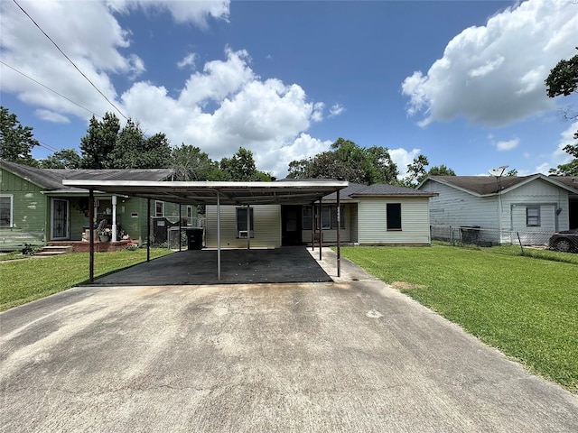 2066 Earl St, Beaumont, TX 77703 - view of front of house featuring concrete driveway and a carport