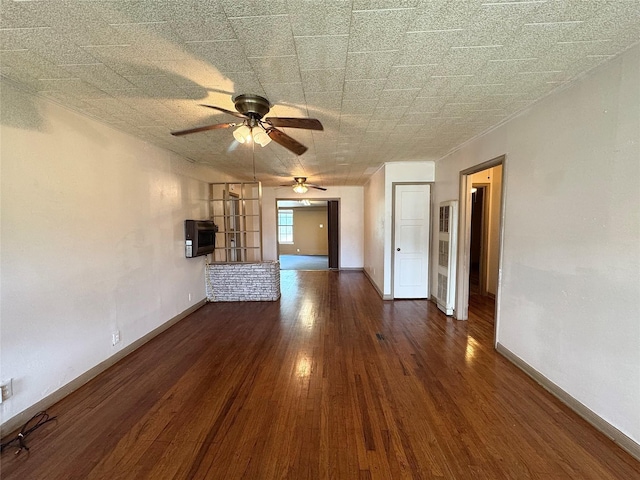2066 Earl St, Beaumont, TX 77703 - unfurnished living room with a ceiling fan and wood finished floors