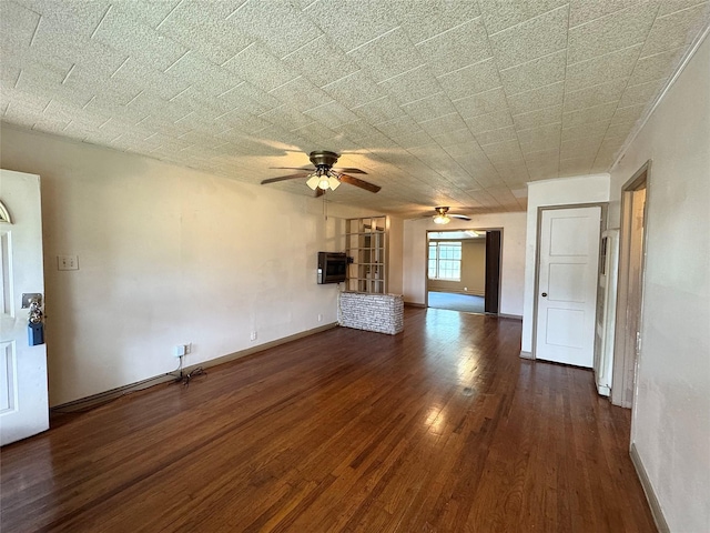 2066 Earl St, Beaumont, TX 77703 - unfurnished living room with ceiling fan and dark wood-type flooring