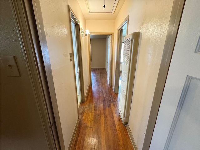 2066 Earl St, Beaumont, TX 77703 - hall with a heating unit, hardwood / wood-style floors, and a textured wall