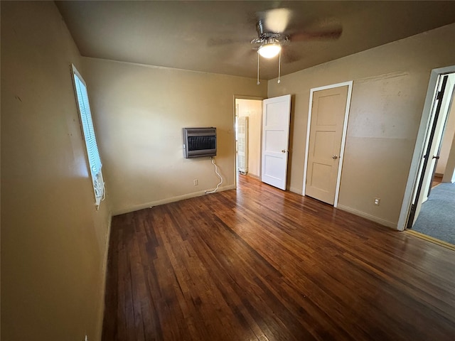 2066 Earl St, Beaumont, TX 77703 - unfurnished bedroom featuring heating unit, wood-type flooring, and a ceiling fan