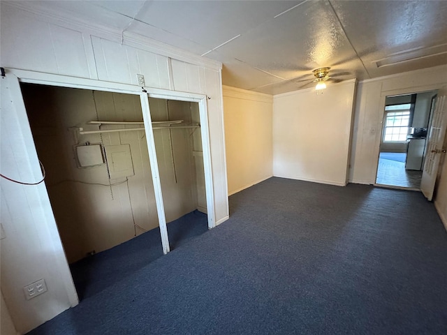 2066 Earl St, Beaumont, TX 77703 - unfurnished bedroom featuring dark colored carpet and a ceiling fan
