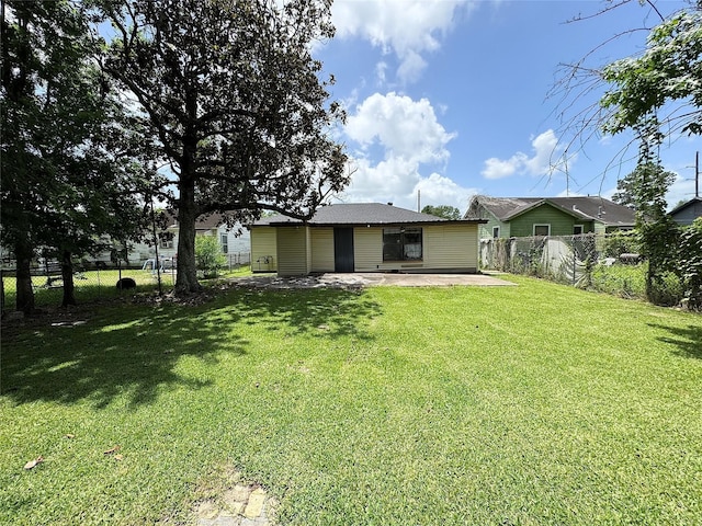 2066 Earl St, Beaumont, TX 77703 - fenced backyard with a patio area