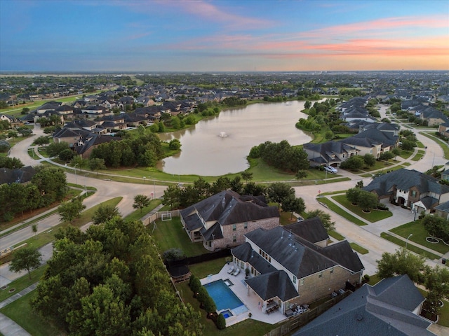 5119 Kendalia Cloud Ln, Fulshear, TX 77441 - aerial view at dusk of a water view and a residential view