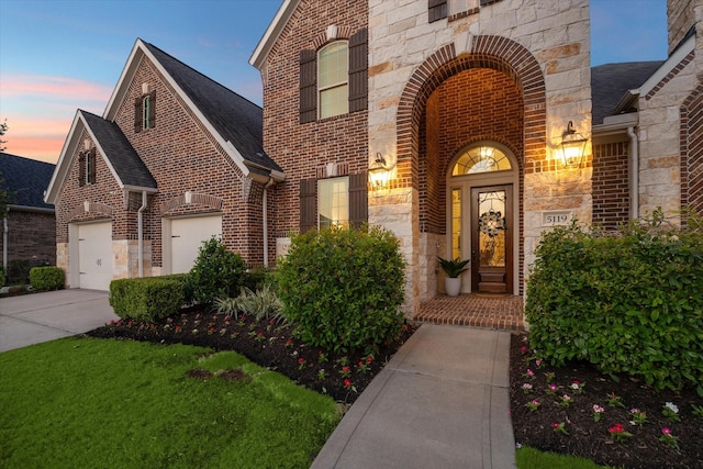 5119 Kendalia Cloud Ln, Fulshear, TX 77441 - view of front of home featuring brick siding, stone siding, driveway, an attached garage, and a shingled roof