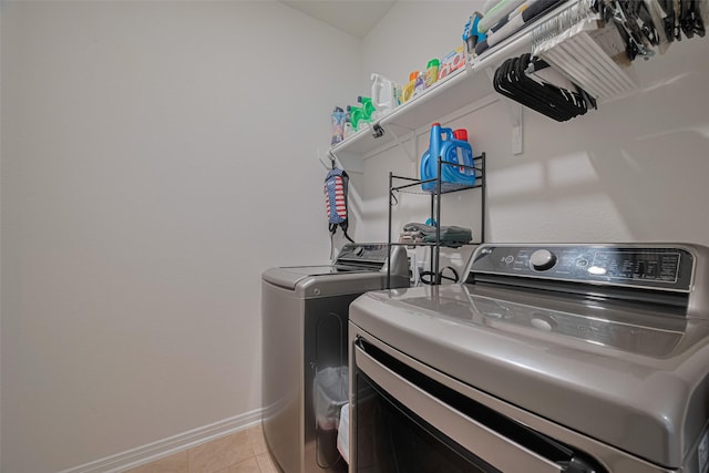 7227 Birchville Dr, Rosharon, TX 77583 - laundry area with washer and dryer and light tile patterned floors