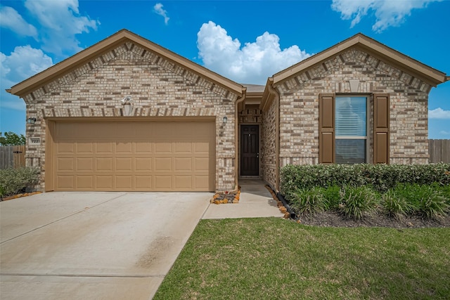 7227 Birchville Dr, Rosharon, TX 77583 - view of front of house with driveway, a garage, and brick siding