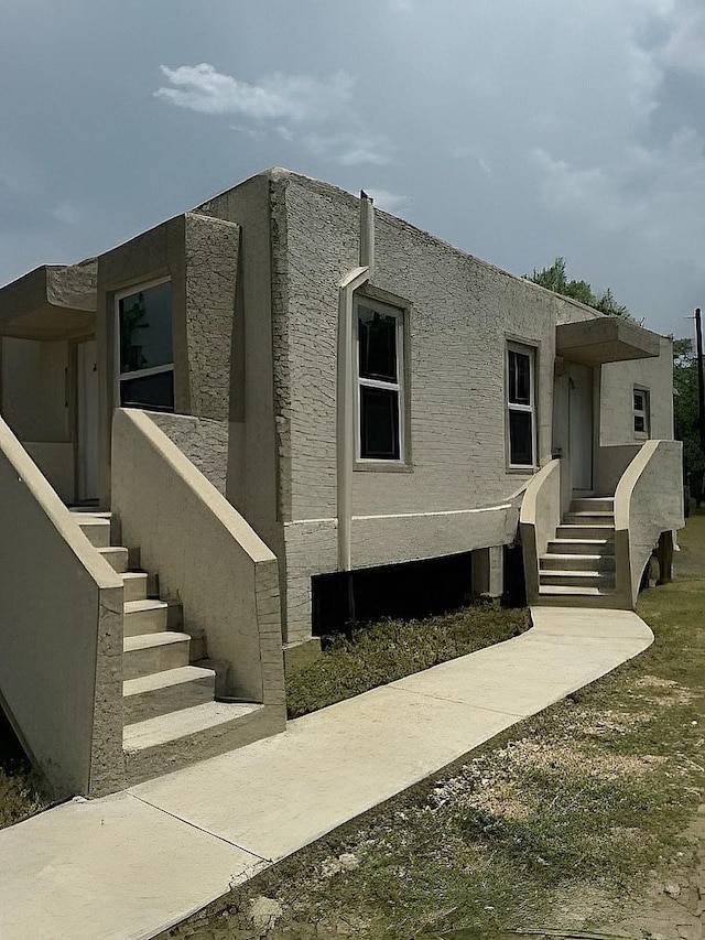 6709 Jensen St, Hitchcock, TX 77563 - view of property exterior featuring stucco siding