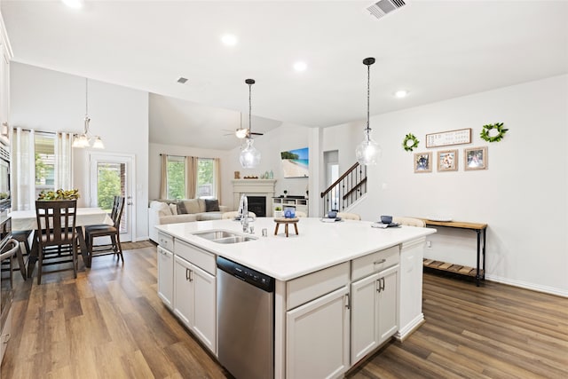 248 Scarlet Maple Way, Conroe, TX 77318 - kitchen with stainless steel dishwasher, a fireplace, dark wood-type flooring, a ceiling fan, and recessed lighting