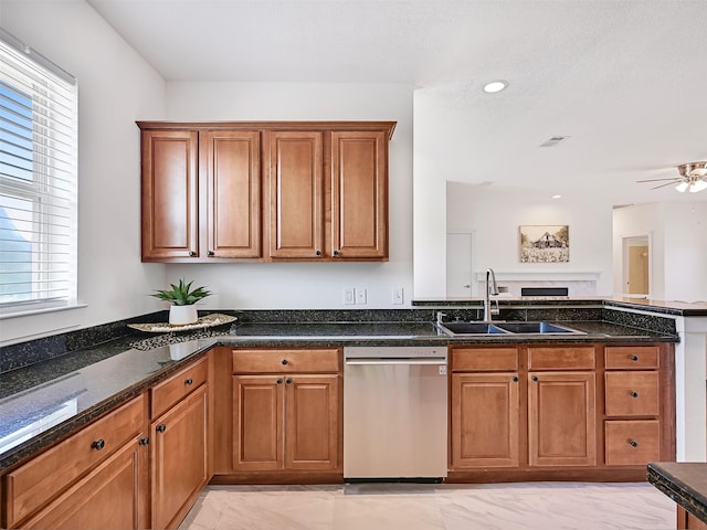 2803 Mayapan Ct, Galveston, TX 77554 - kitchen featuring stainless steel dishwasher, light marble finish floors, a peninsula, brown cabinets, and recessed lighting