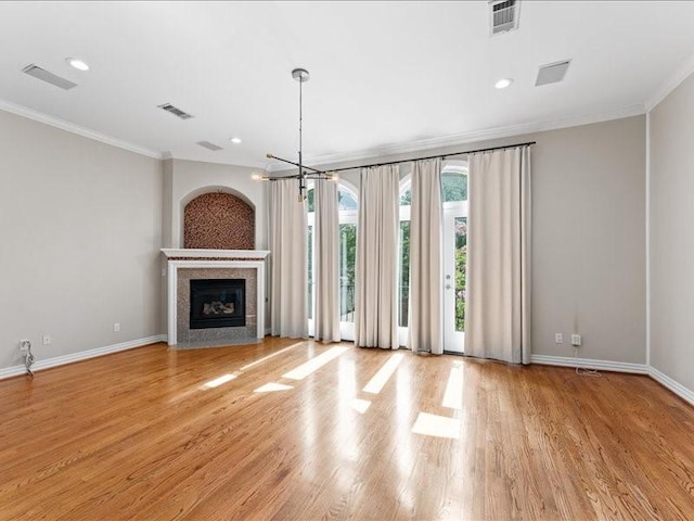 405 Reinerman St, Houston, TX 77007 - unfurnished living room featuring ornamental molding, wood finished floors, a fireplace, and recessed lighting