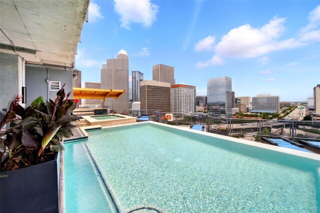 2000 Bagby St Unit 5423, Houston, TX 77002 - view of swimming pool with a view of skyline and a pool with connected hot tub