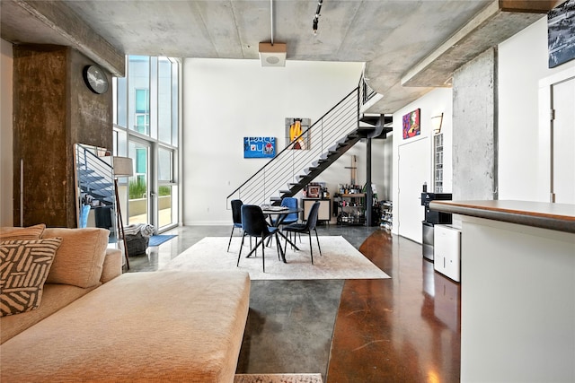 2000 Bagby St Unit 5423, Houston, TX 77002 - living area with concrete flooring and stairs