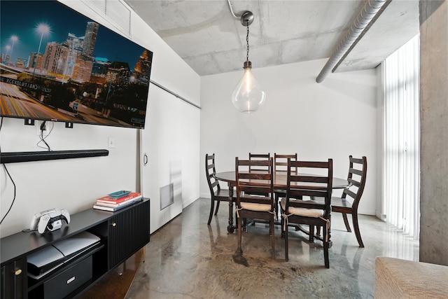 2000 Bagby St Unit 5423, Houston, TX 77002 - dining room with finished concrete floors