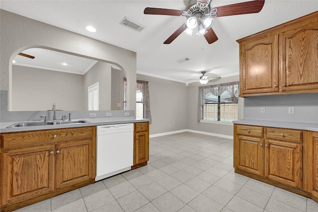 13314 Kaylee Ln, Santa Fe, TX 77510 - kitchen featuring white dishwasher, arched walkways, a ceiling fan, brown cabinets, and crown molding