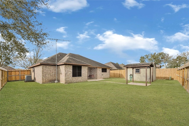 13314 Kaylee Ln, Santa Fe, TX 77510 - rear view of property featuring a fenced backyard, a patio, and an outdoor structure