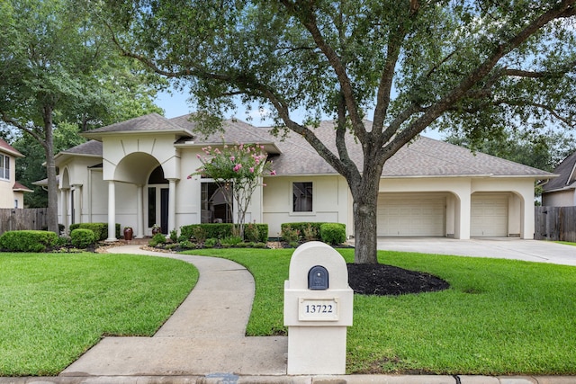 13722 Vinery Ln, Cypress, TX 77429 - view of front facade with concrete driveway, a garage, a shingled roof, and stucco siding