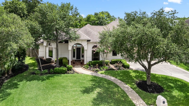 13722 Vinery Ln, Cypress, TX 77429 - view of front of house with roof with shingles, a chimney, stucco siding, and concrete driveway