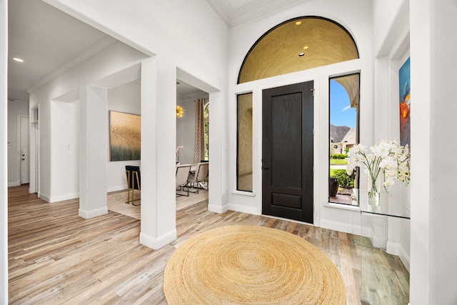 13722 Vinery Ln, Cypress, TX 77429 - entrance foyer with ornamental molding, wood finished floors, and recessed lighting