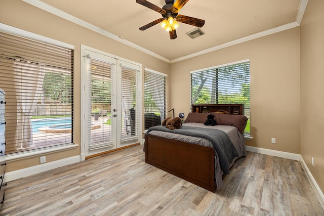 13722 Vinery Ln, Cypress, TX 77429 - bedroom with french doors, access to exterior, light wood-style floors, ornamental molding, and ceiling fan