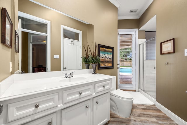 13722 Vinery Ln, Cypress, TX 77429 - bathroom with ornamental molding, wood finished floors, vanity, and a shower stall
