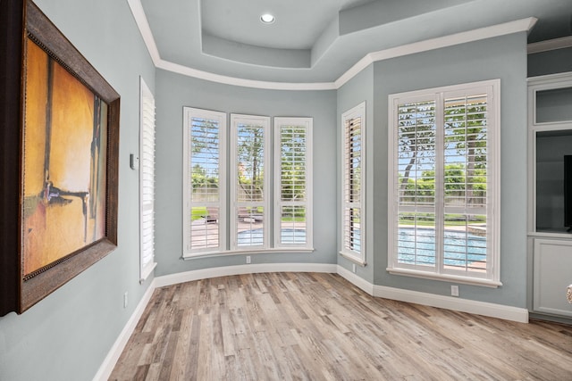 13722 Vinery Ln, Cypress, TX 77429 - empty room with plenty of natural light, light wood-style floors, a raised ceiling, crown molding, and recessed lighting