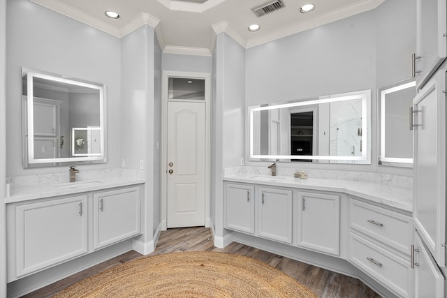13722 Vinery Ln, Cypress, TX 77429 - full bathroom with ornamental molding, two vanities, wood finished floors, a shower, and recessed lighting