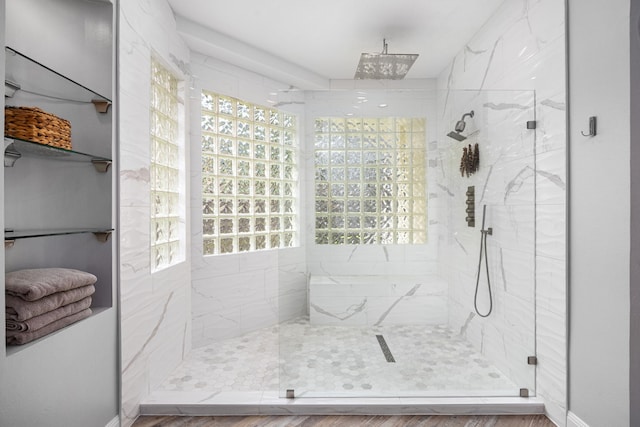13722 Vinery Ln, Cypress, TX 77429 - full bathroom featuring a marble finish shower, healthy amount of natural light, and wood finished floors