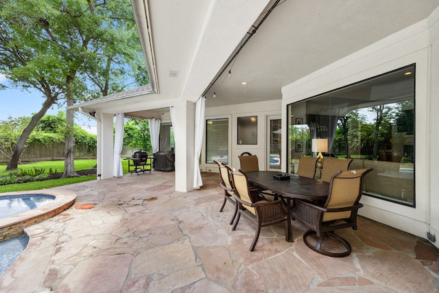13722 Vinery Ln, Cypress, TX 77429 - view of patio / terrace with outdoor dining area and a jacuzzi