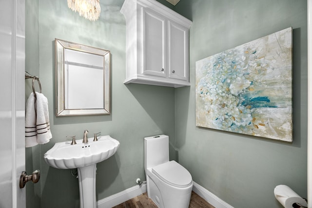 13722 Vinery Ln, Cypress, TX 77429 - half bathroom featuring wood finished floors and baseboards