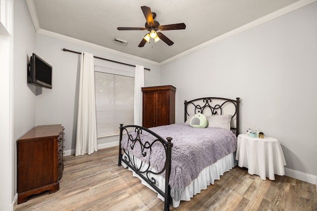 13722 Vinery Ln, Cypress, TX 77429 - bedroom with light wood-style floors, ornamental molding, and ceiling fan