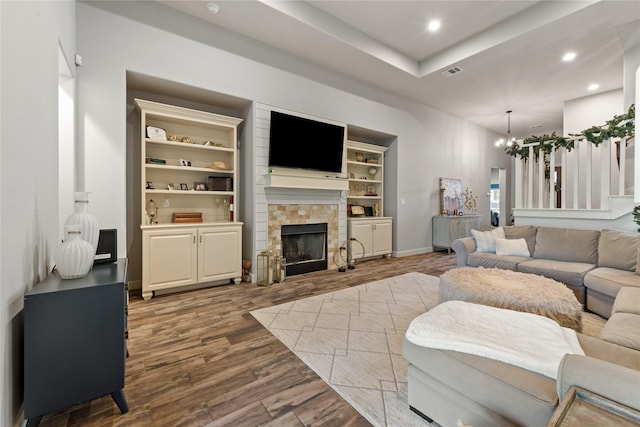 2619 Portland Ave, College Station, TX 77845 - living area featuring a chandelier, wood finished floors, recessed lighting, and a fireplace