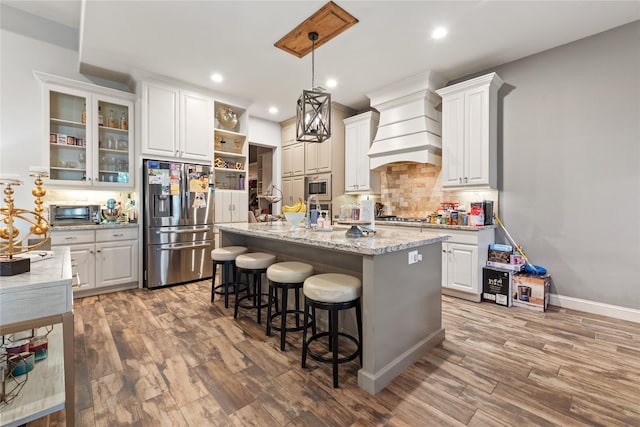 2619 Portland Ave, College Station, TX 77845 - kitchen featuring stainless steel appliances, custom range hood, open shelves, backsplash, and recessed lighting