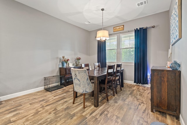2619 Portland Ave, College Station, TX 77845 - dining area with wood finished floors and a chandelier